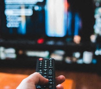 A resident enjoys relaxes and watches television